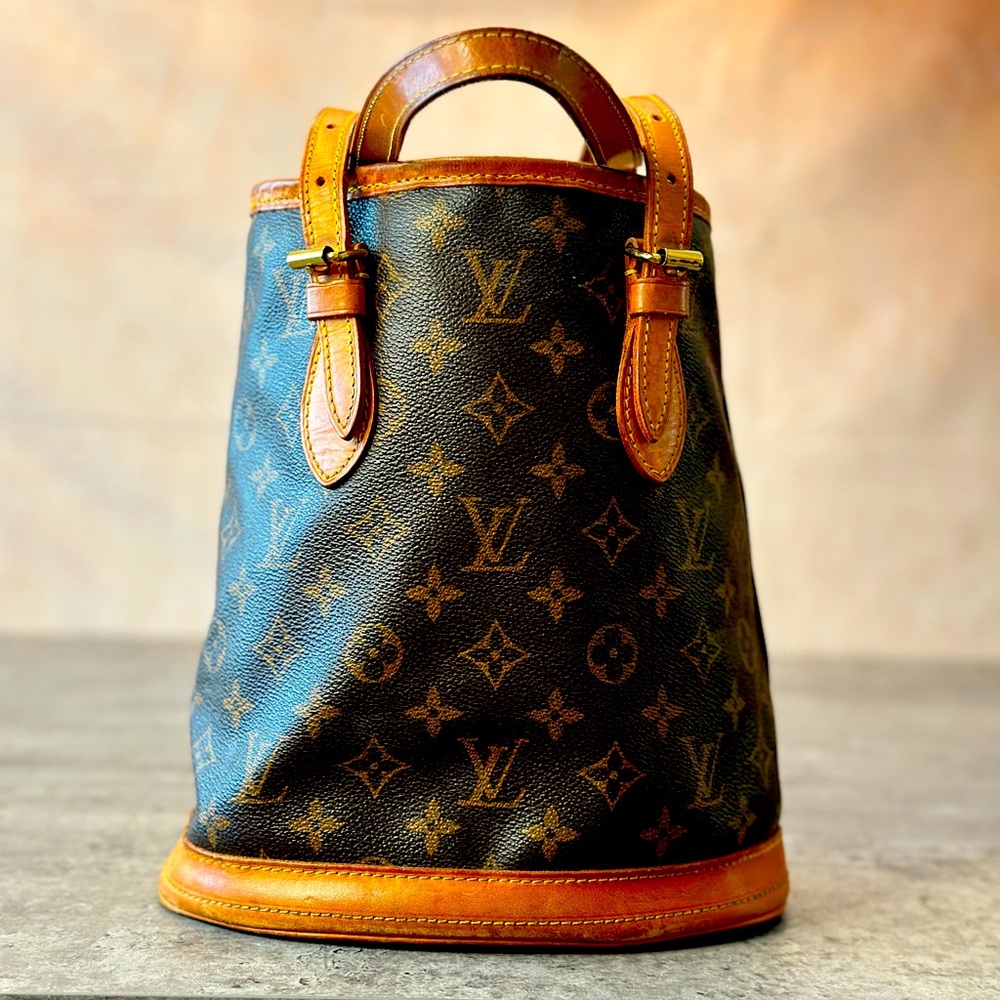 1. LOUIS VUITTON MONOGRAM PETIT BUCKET BAG.